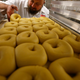 Kossar's Bagels and Bialys co-owner and classically-trained French chef David Zablocki checks a tray of bagels.